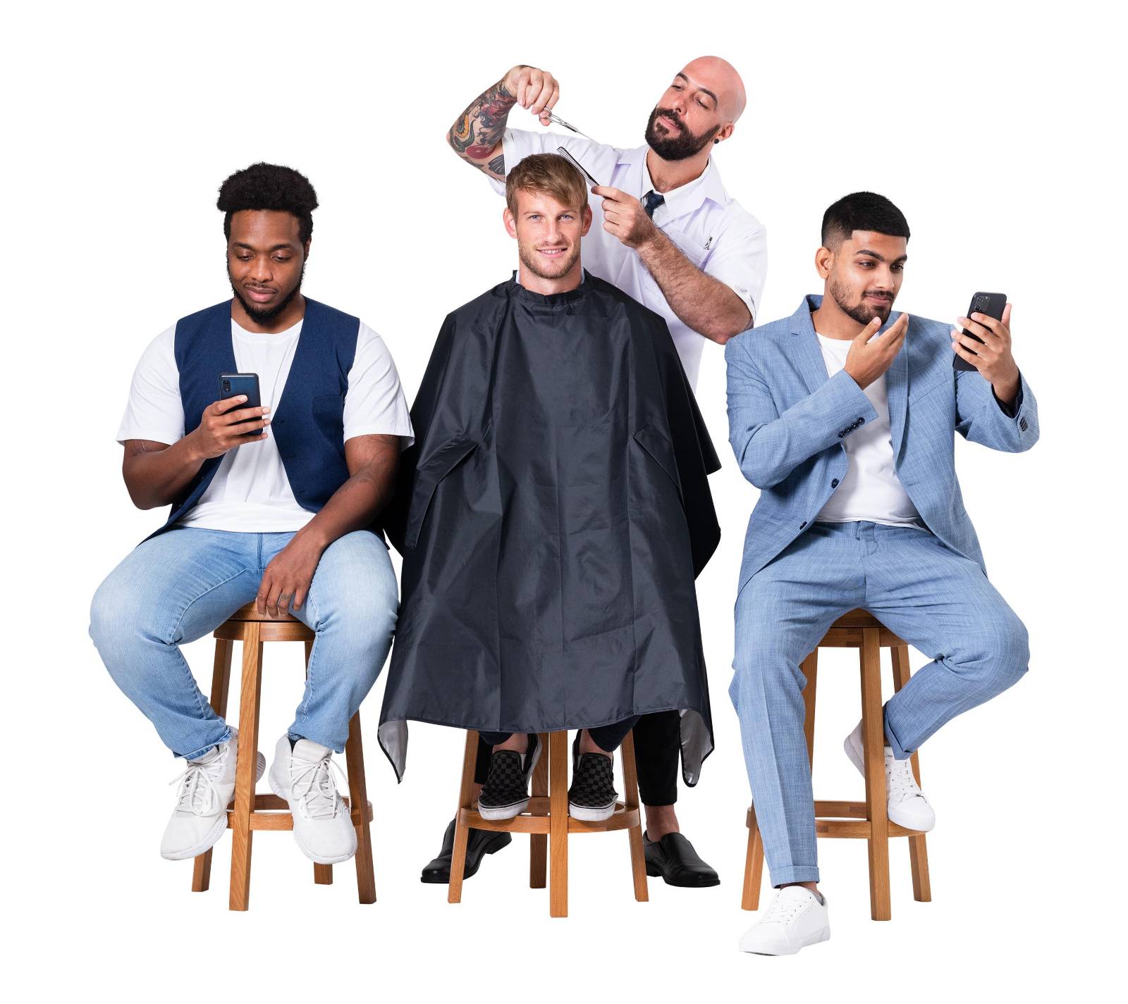 Clients booking on phones while getting a cut